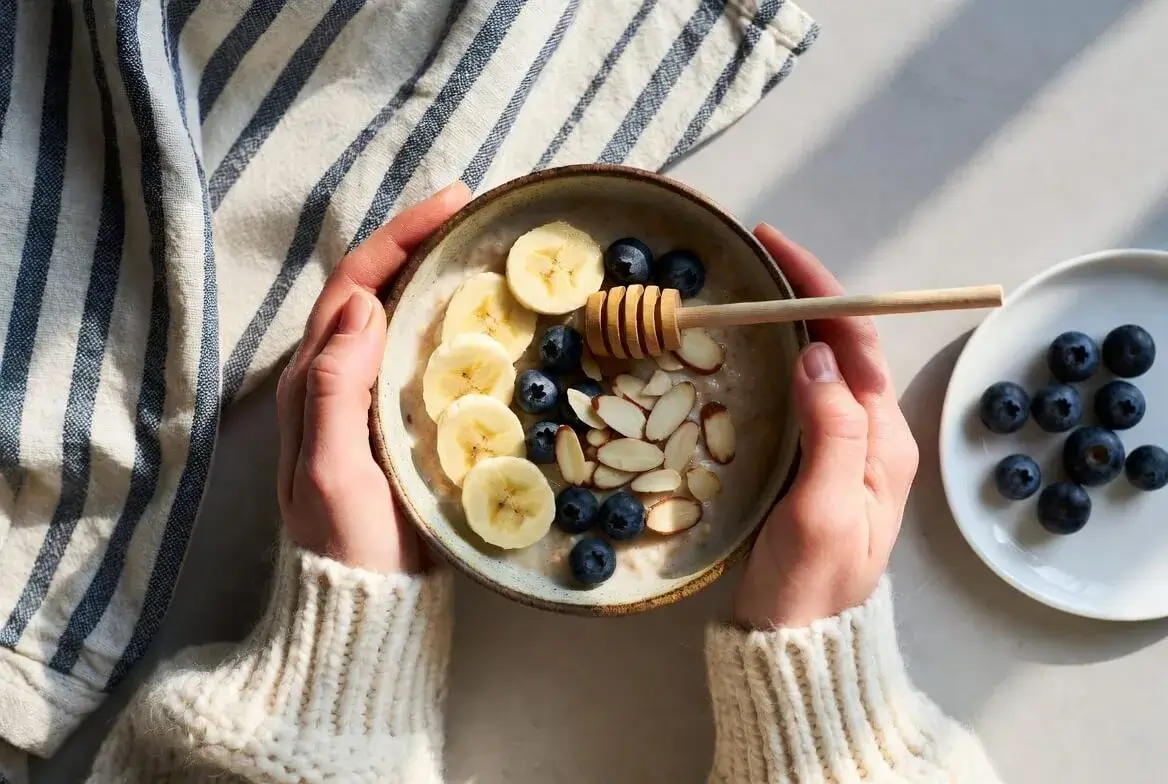 Healthy breakfast bowl with oats, fresh fruits and nuts